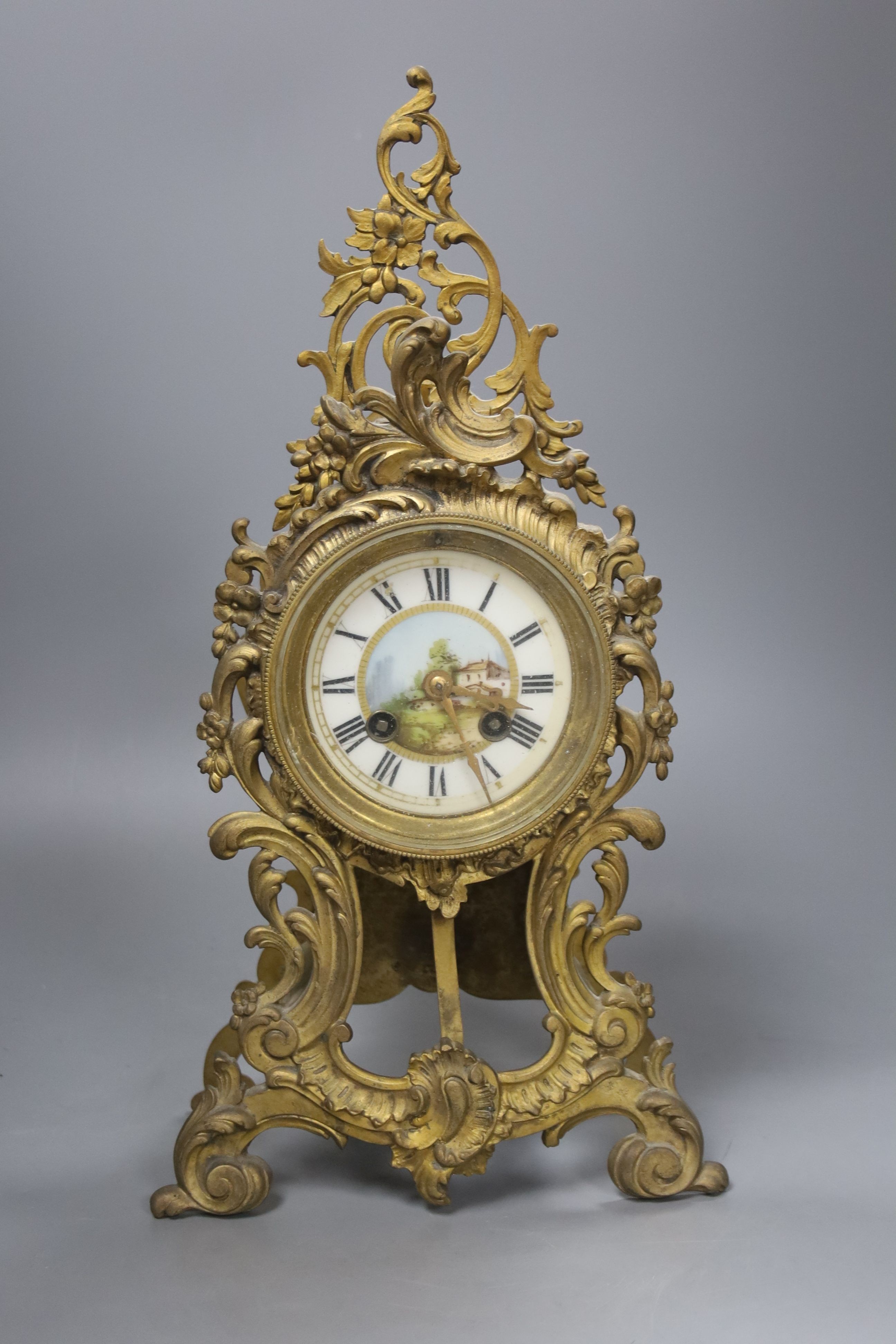 A late 19th century French gilt brass mantel clock, 40 cm high.